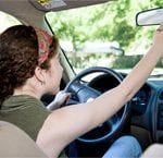 Could You Be Saving More On Your Auto Insurance? 10 117450246_girl_adjusting_rearview_mirror