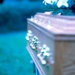 Insurance And Funeral Homes Go Hand In Hand 9 close-up of the side of a coffin with brass handles